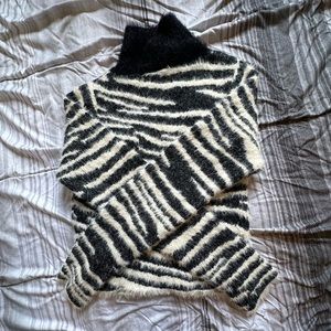 Two turtleneck sweaters